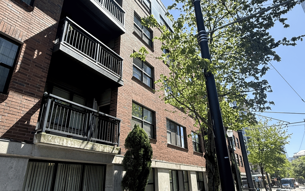 picture of brick apartment building before pressure washing Hillsboro Oregon.png