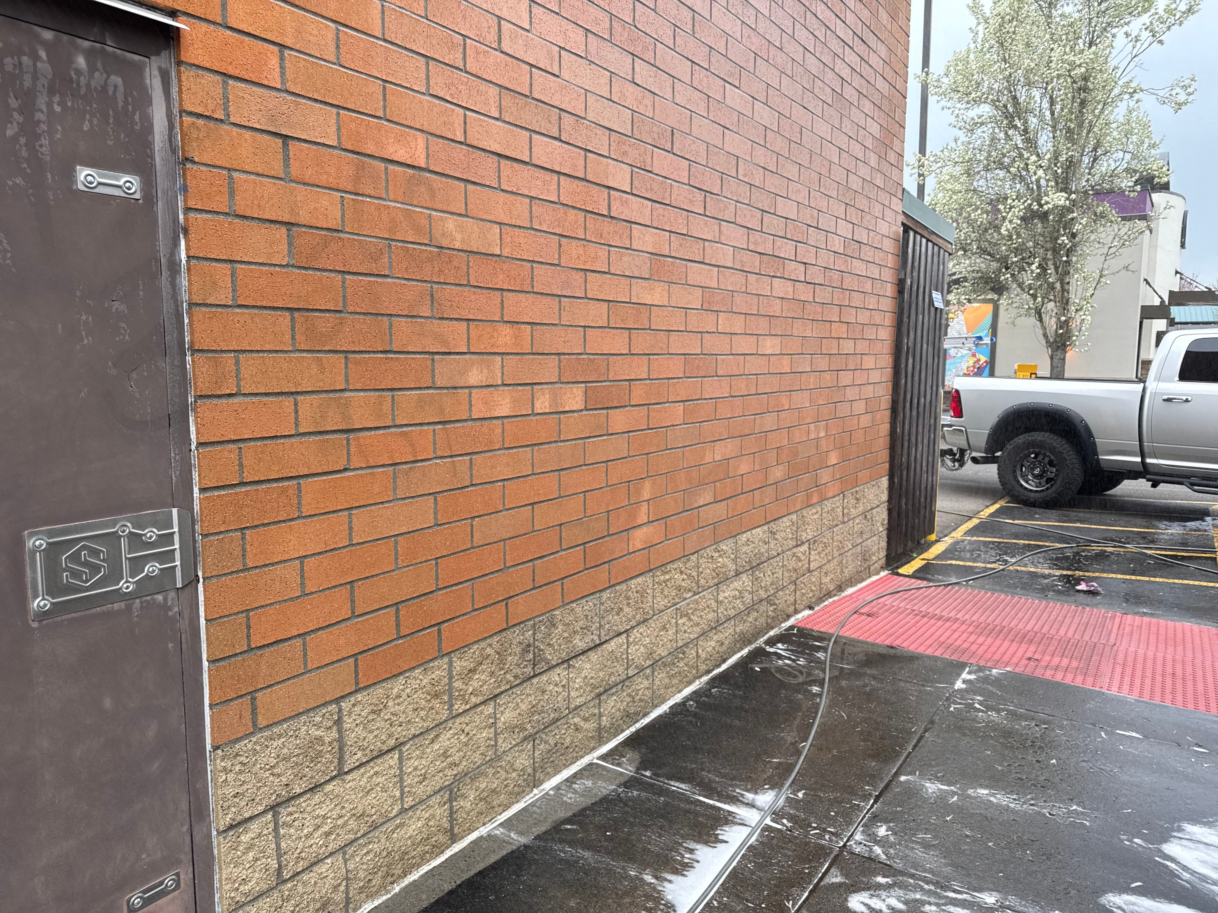 The brick of a commercial building after being pressure washed.