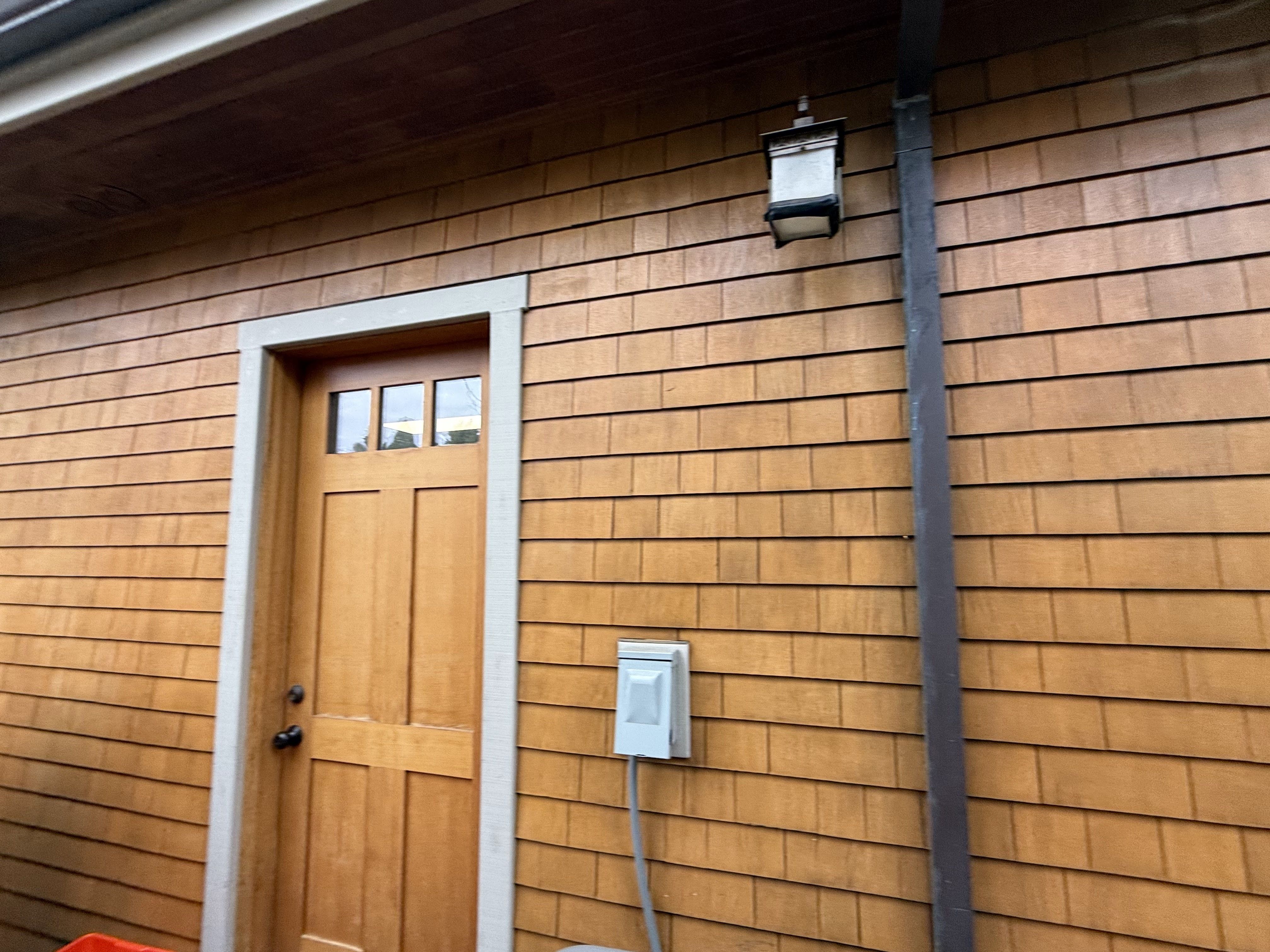The siding of a residential property after oxidation removal services.